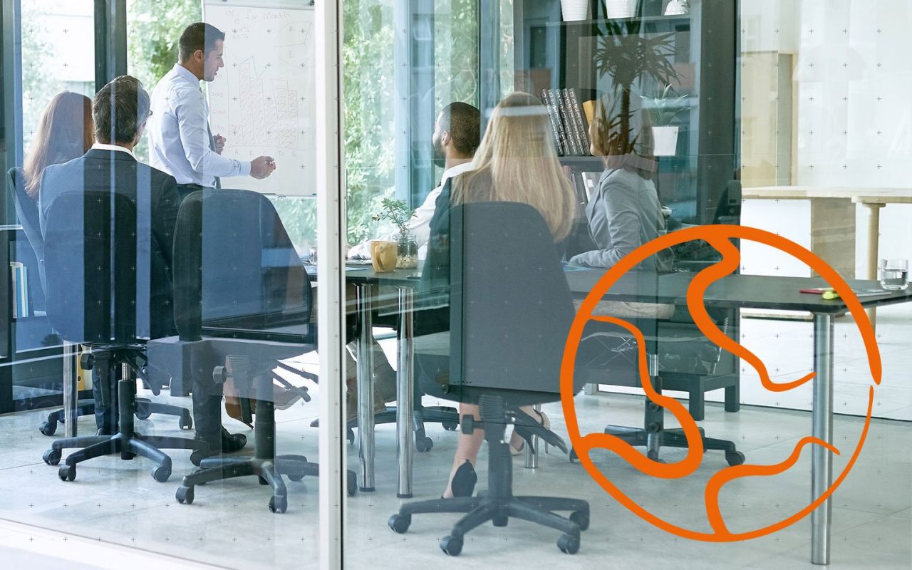 workers in a glass meeting room