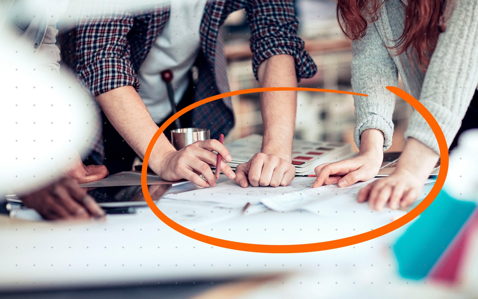 shot of people working at a desk with icon