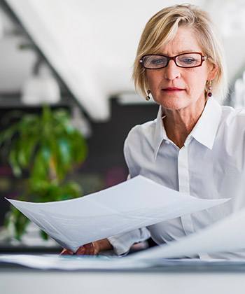 Growth woman looking at documents