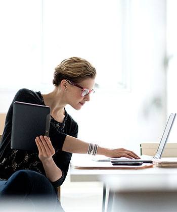 Digital Personnel Management woman typing in a computer