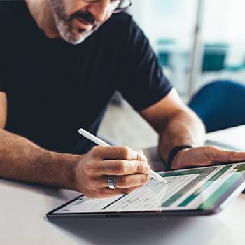 Why do you need to streamline your workflows? man typing in his tablet
